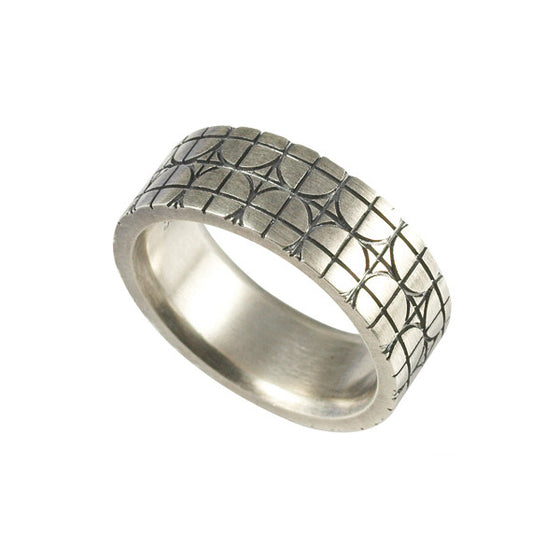 Silver band featuring circles and lines pattern
