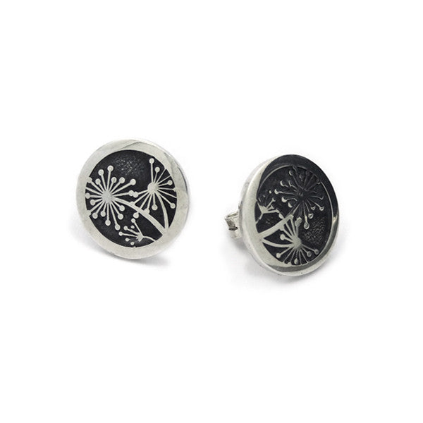 stunning dandelion earrings with blackened background