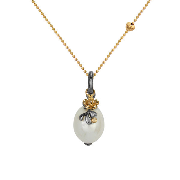 Stunning and unusual pearl pendant with black and gold flower detailing