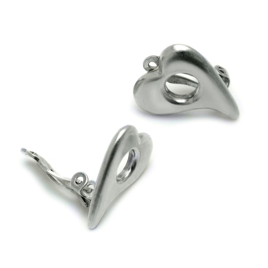 clip-on hole in heart silver earrings by Annika Rutlin