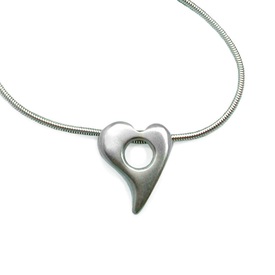 curved hole in heart silver pendant on snake chain Annika Rutlin