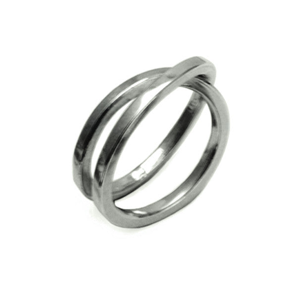 Cross over twist sterling silver wrapped coil ring by Annika Rutlin